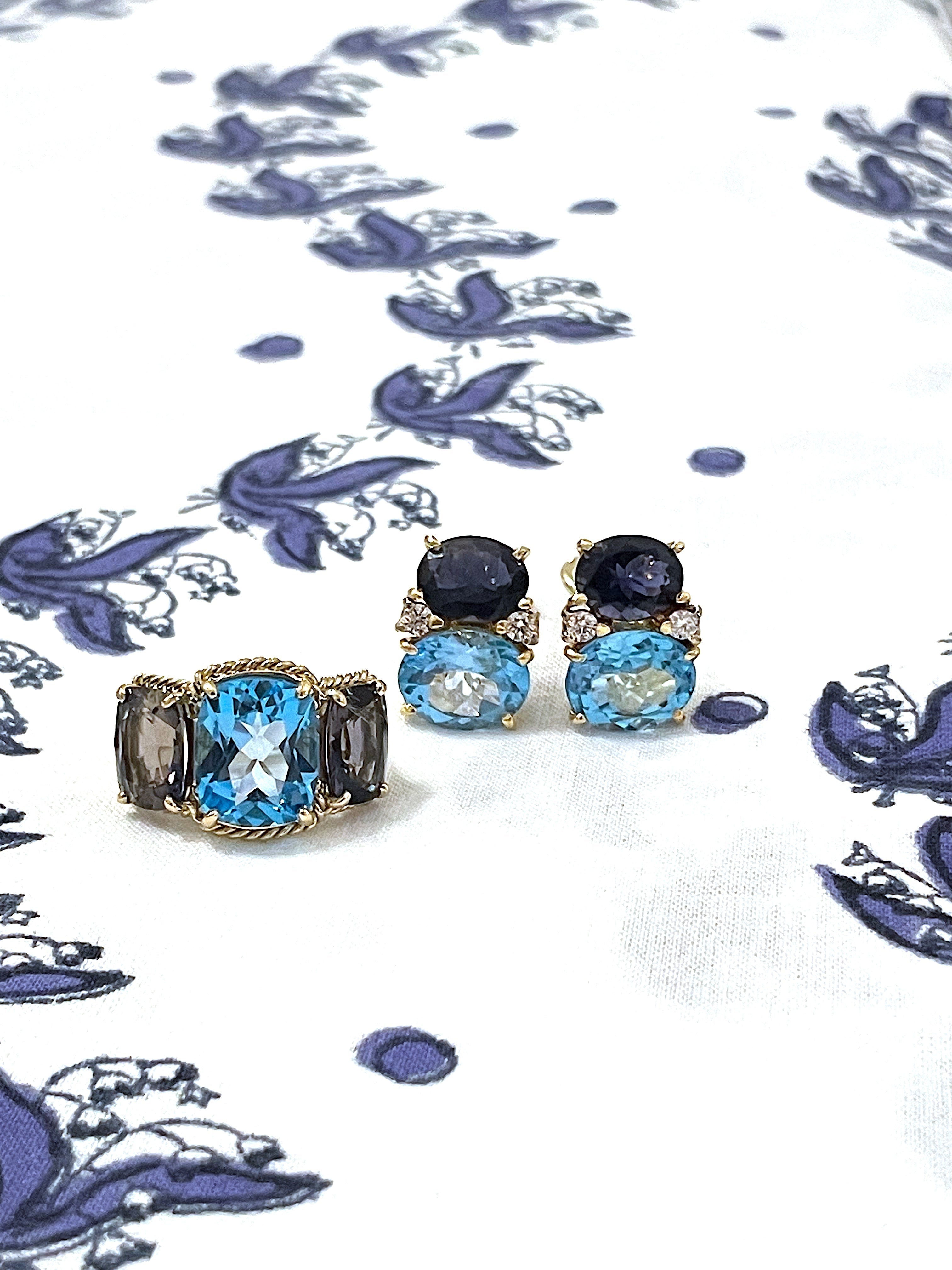 18kt Yellow Gold Three Stone Ring with Pink Topaz and Blue Topaz and Rope Twist Border