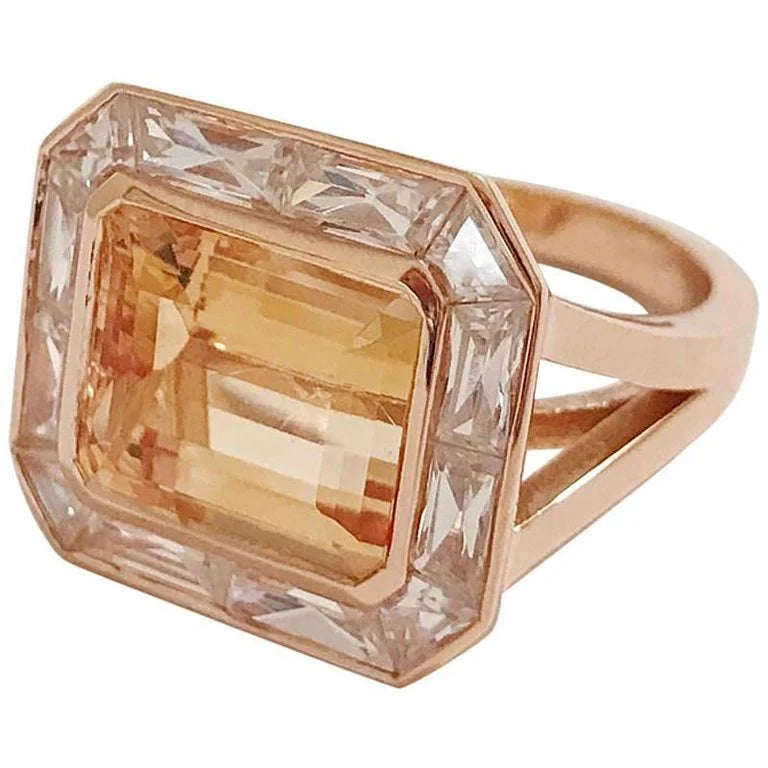 Rose Gold Bezel Set Dark Blue Topaz with Surrounding Pink Sapphire Ring