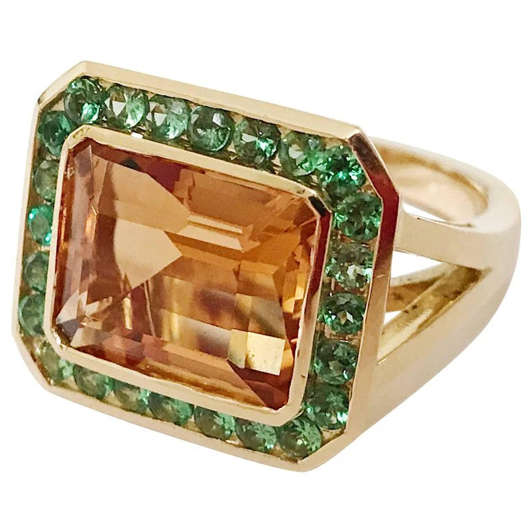 Rose Gold Bezel Set Dark Blue Topaz with Surrounding Pink Sapphire Ring