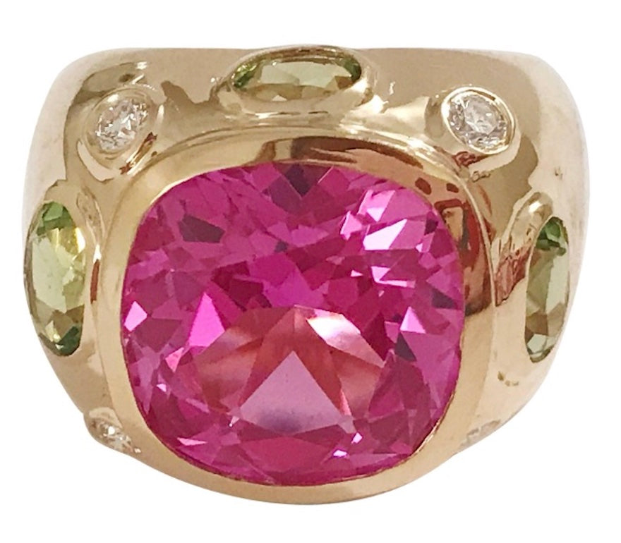 Rose Gold Bezel Set Dark Blue Topaz with Surrounding Pink Sapphire Ring
