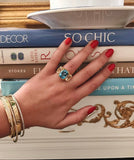 18kt Yellow Gold Three Stone Ring with Pink Topaz and Blue Topaz and Rope Twist Border