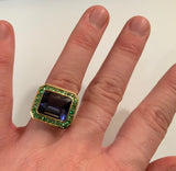 Yellow Gold Bezel Set Ring with Iolite and Surrounding Green Garnet