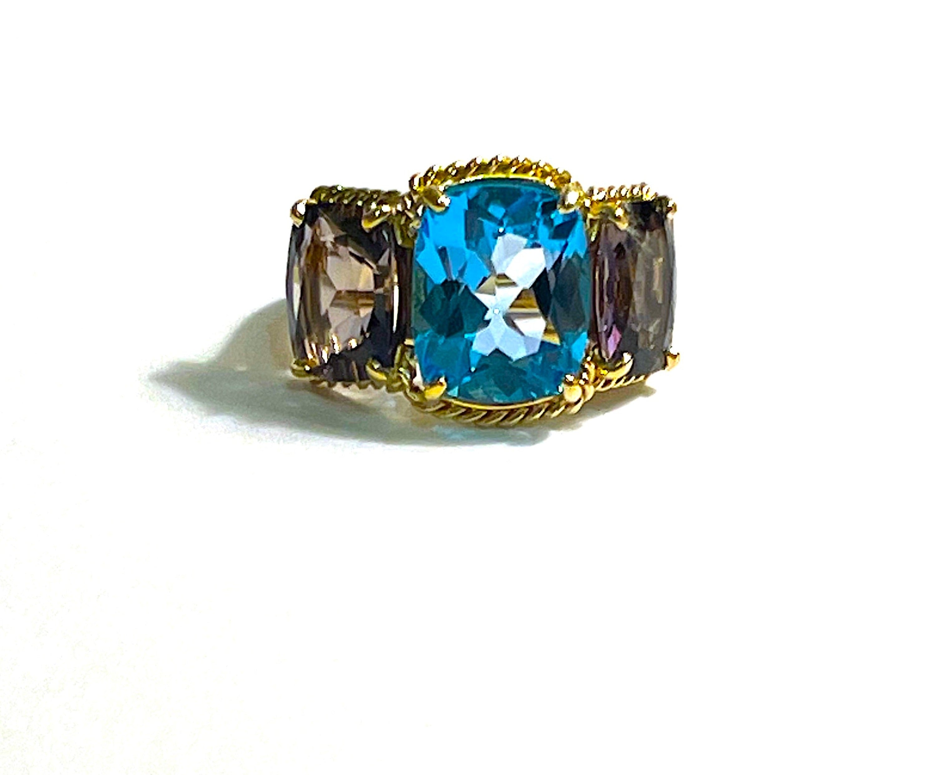 18kt Yellow Gold Three Stone Ring with Pink Topaz and Blue Topaz and Rope Twist Border