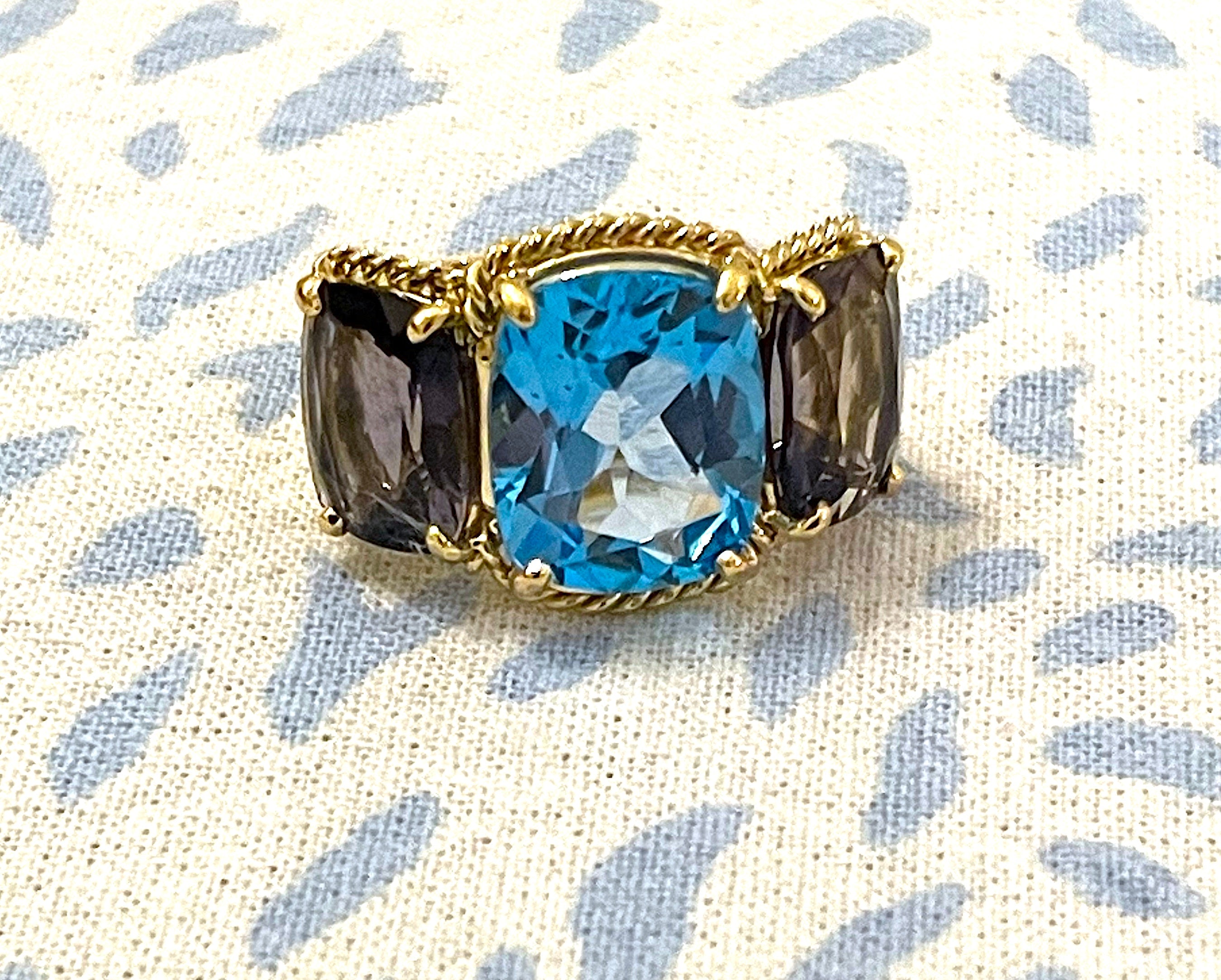 18kt Yellow Gold Three Stone Ring with Pink Topaz and Blue Topaz and Rope Twist Border